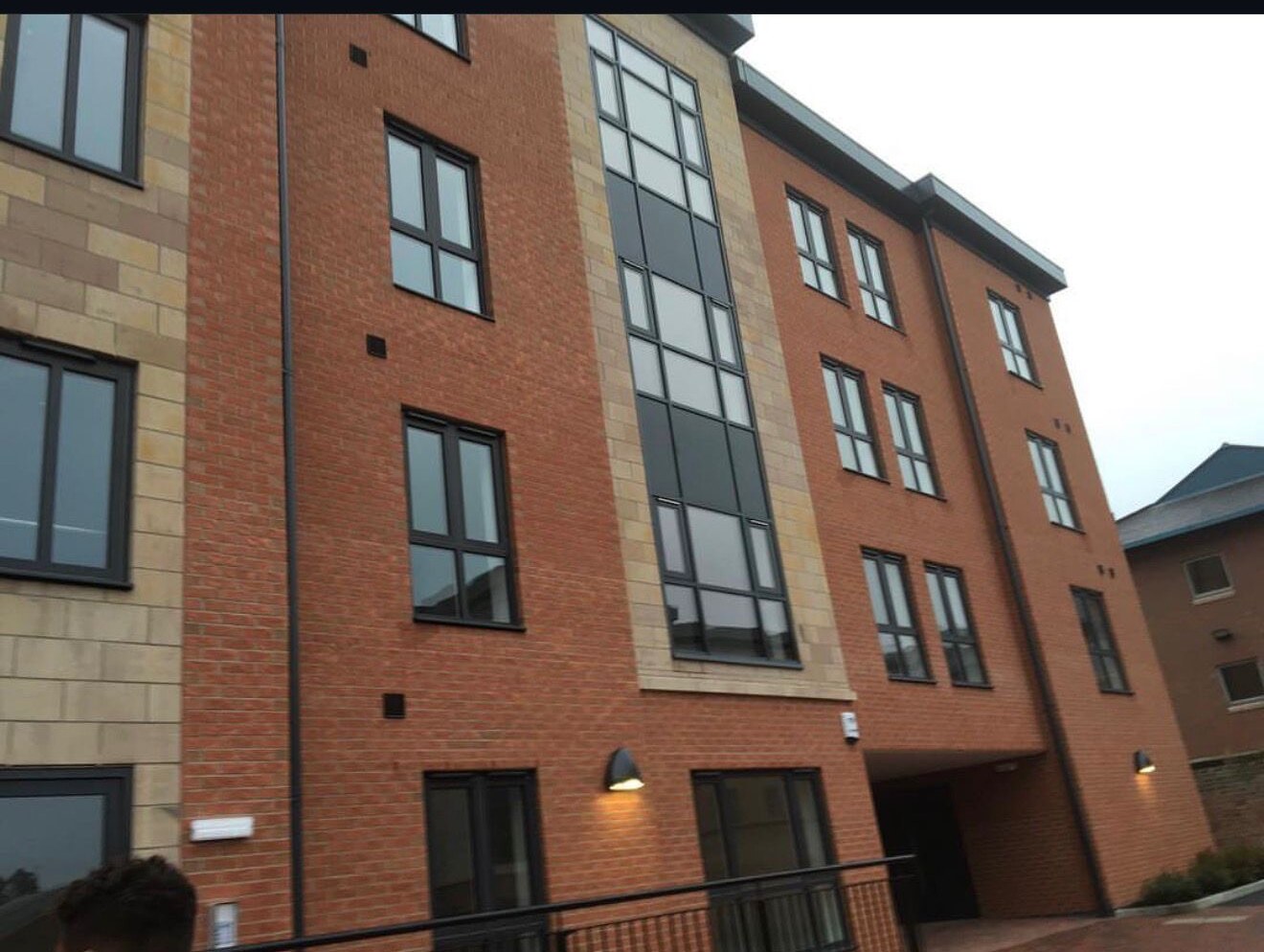 Completed brick and stone apartment block built by Derby Brickwork Ltd in Derby