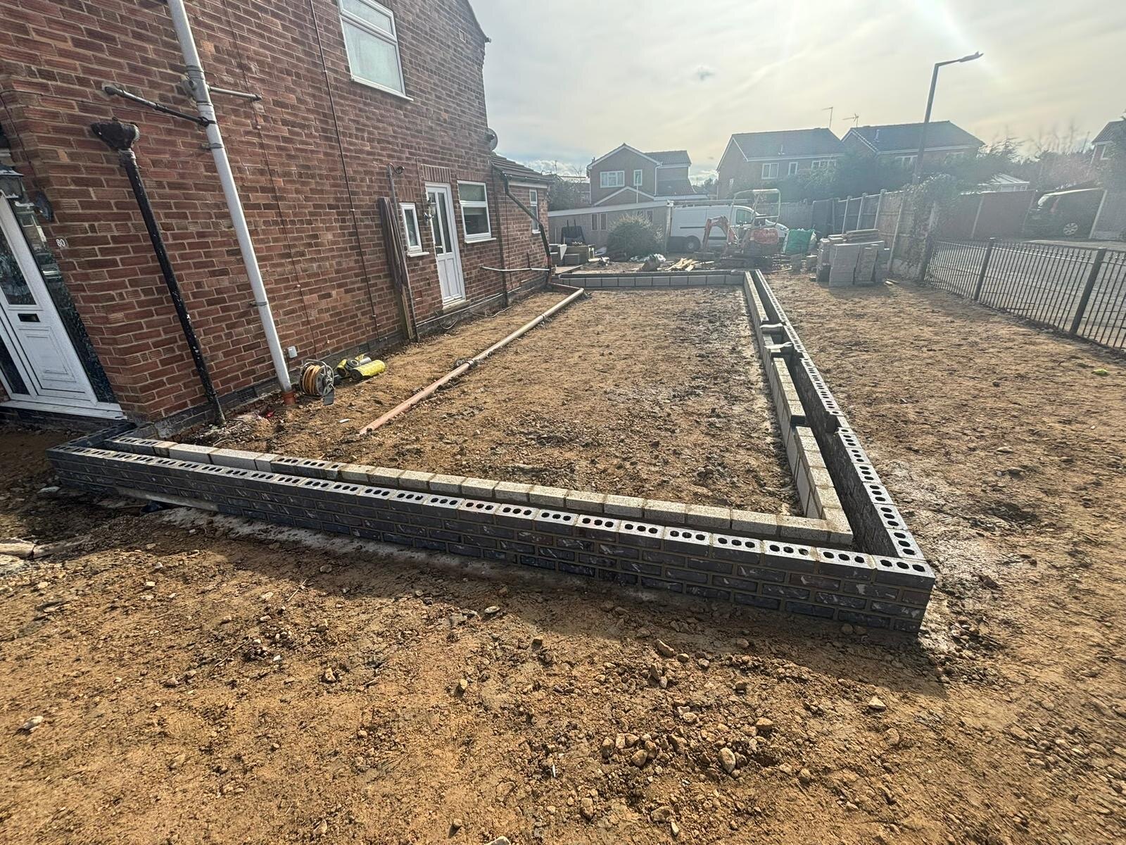 Extension substructure walls in blue brick and blockwork built to damp proof course level
