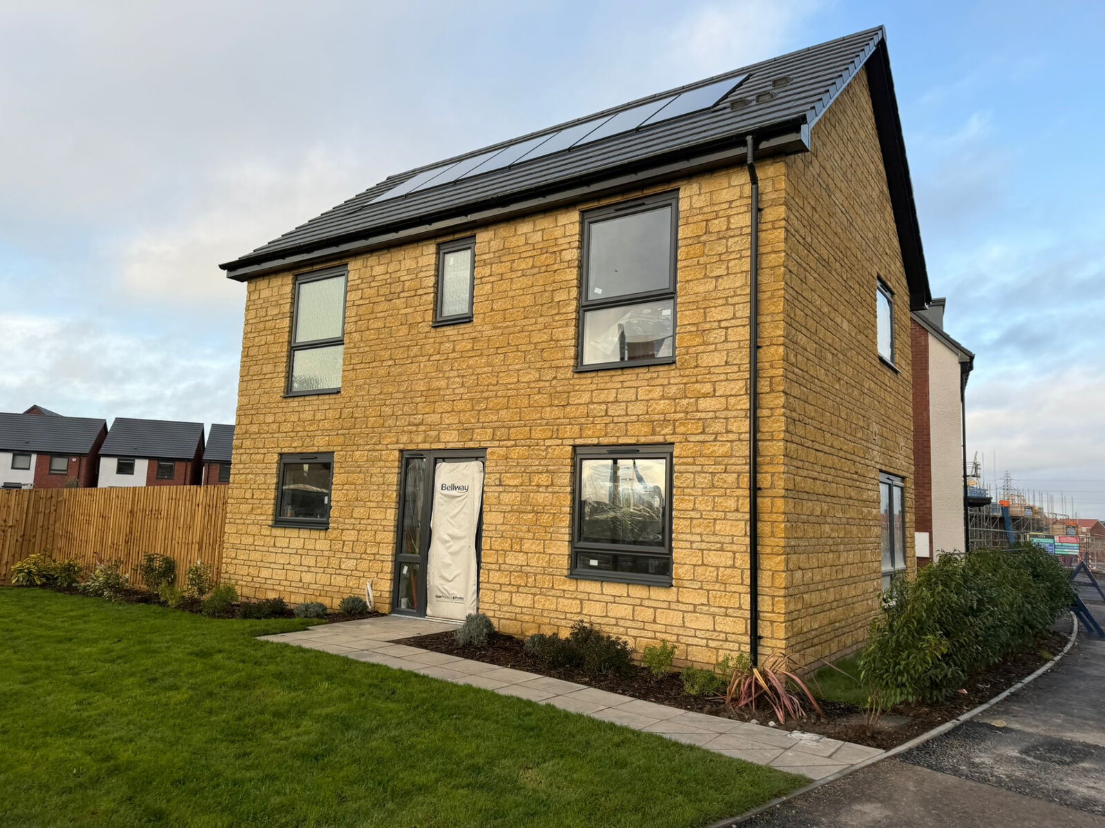 Completed new build detached house with stone elevations built by Derby Brickwork Ltd