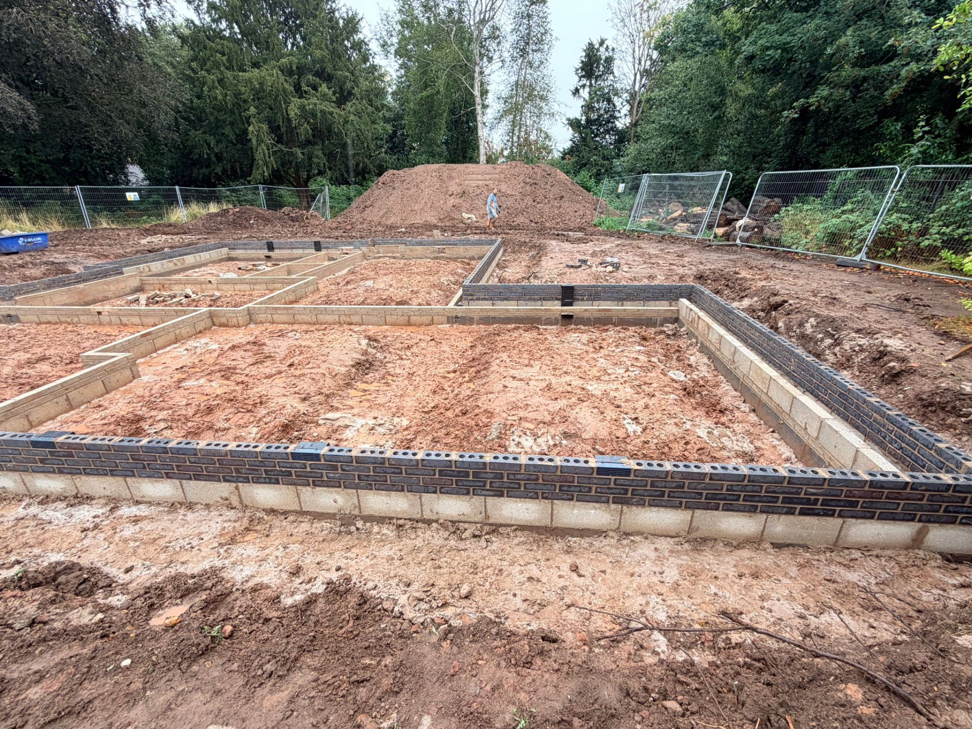 Brick and block foundation walls set out to damp proof course level on a new build plot