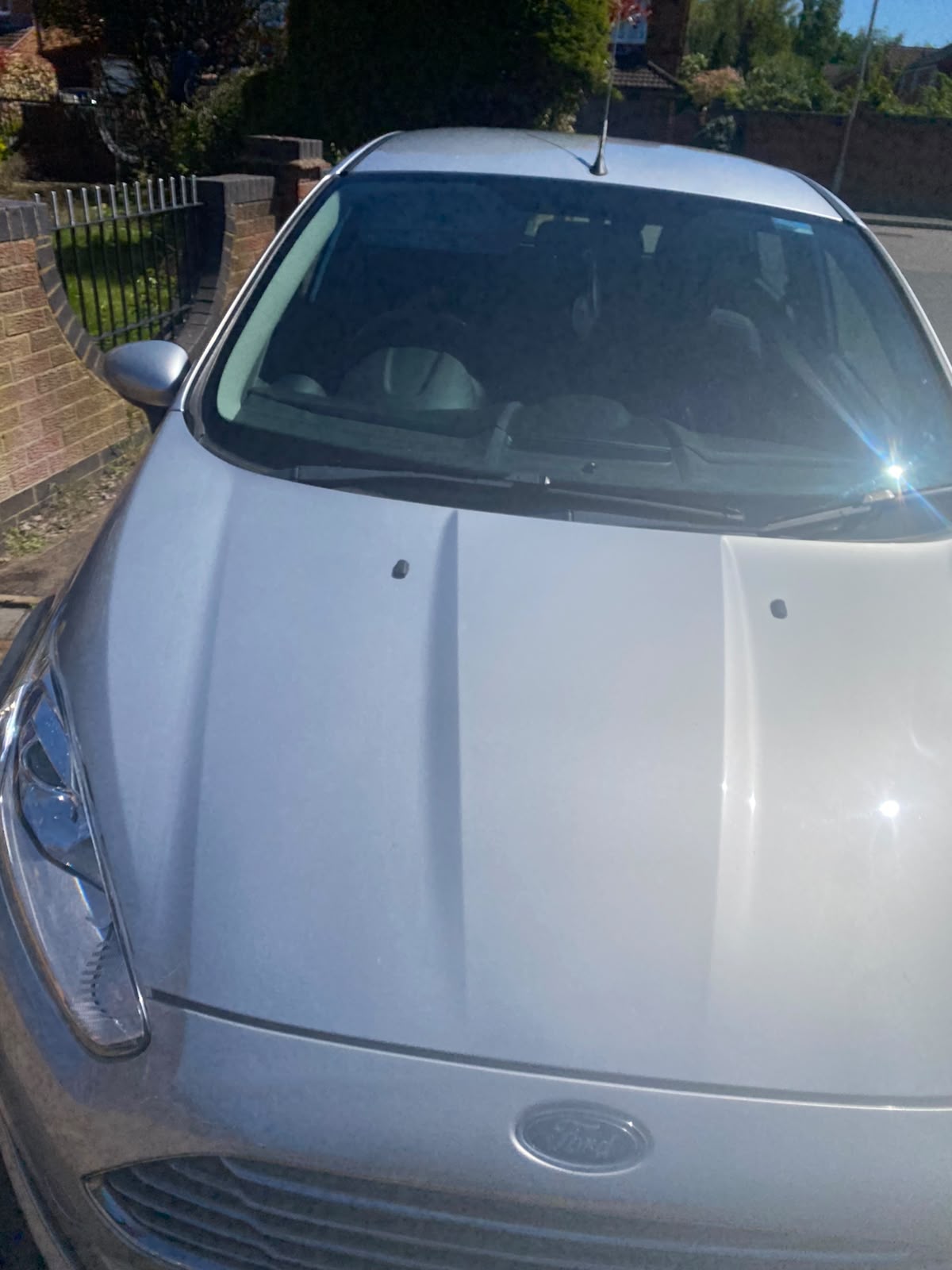 Silver Ford bonnet and windscreen with a streak-free finish