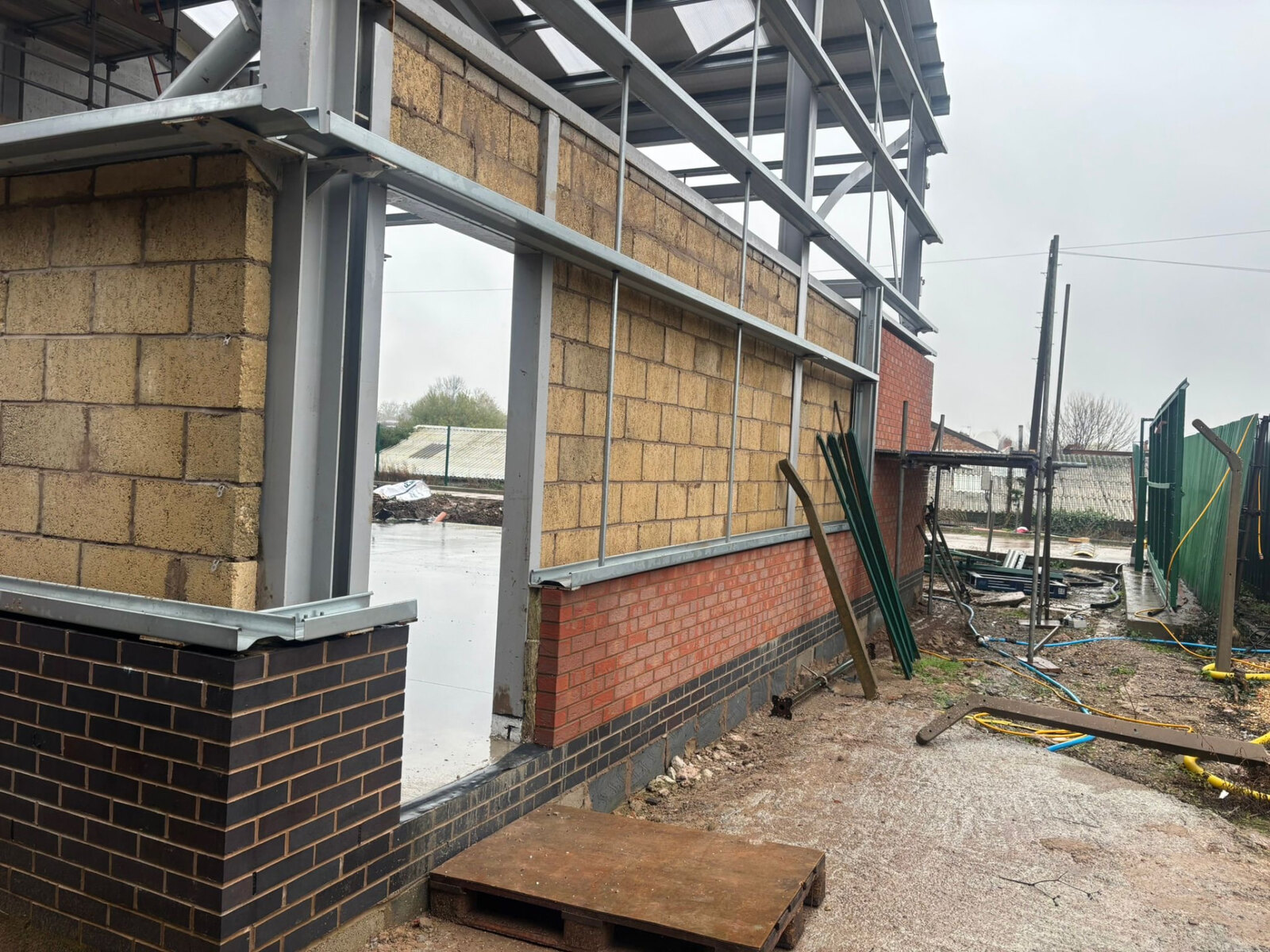 Blockwork and facing brickwork built around a steel frame on a commercial unit in Derby