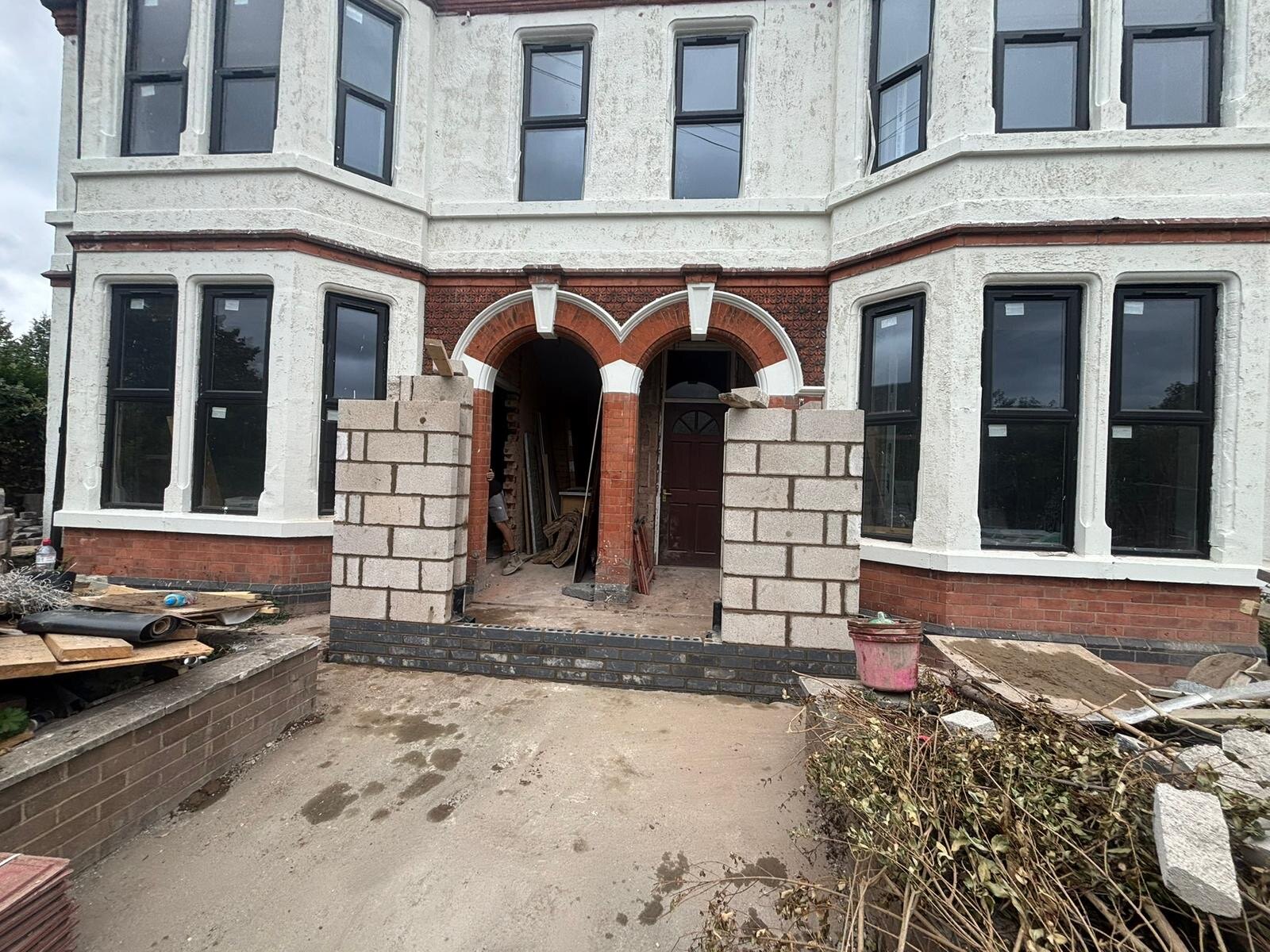 Restored reclaimed brick barn conversion with new gable end