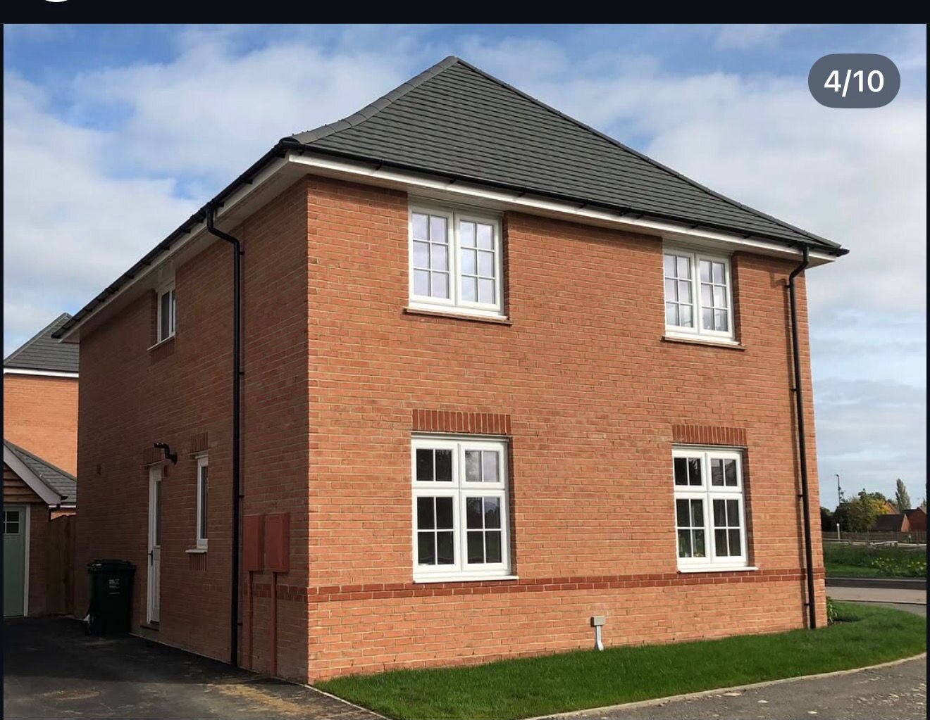 Completed red brick detached new build home with feature brick banding